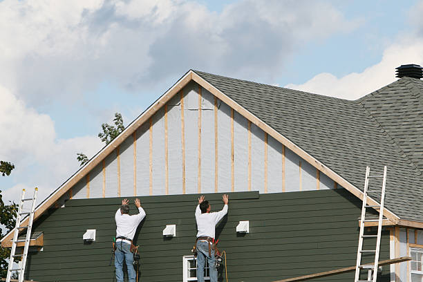 Professional Siding Contractor technician working in Wellesley Hills, MA